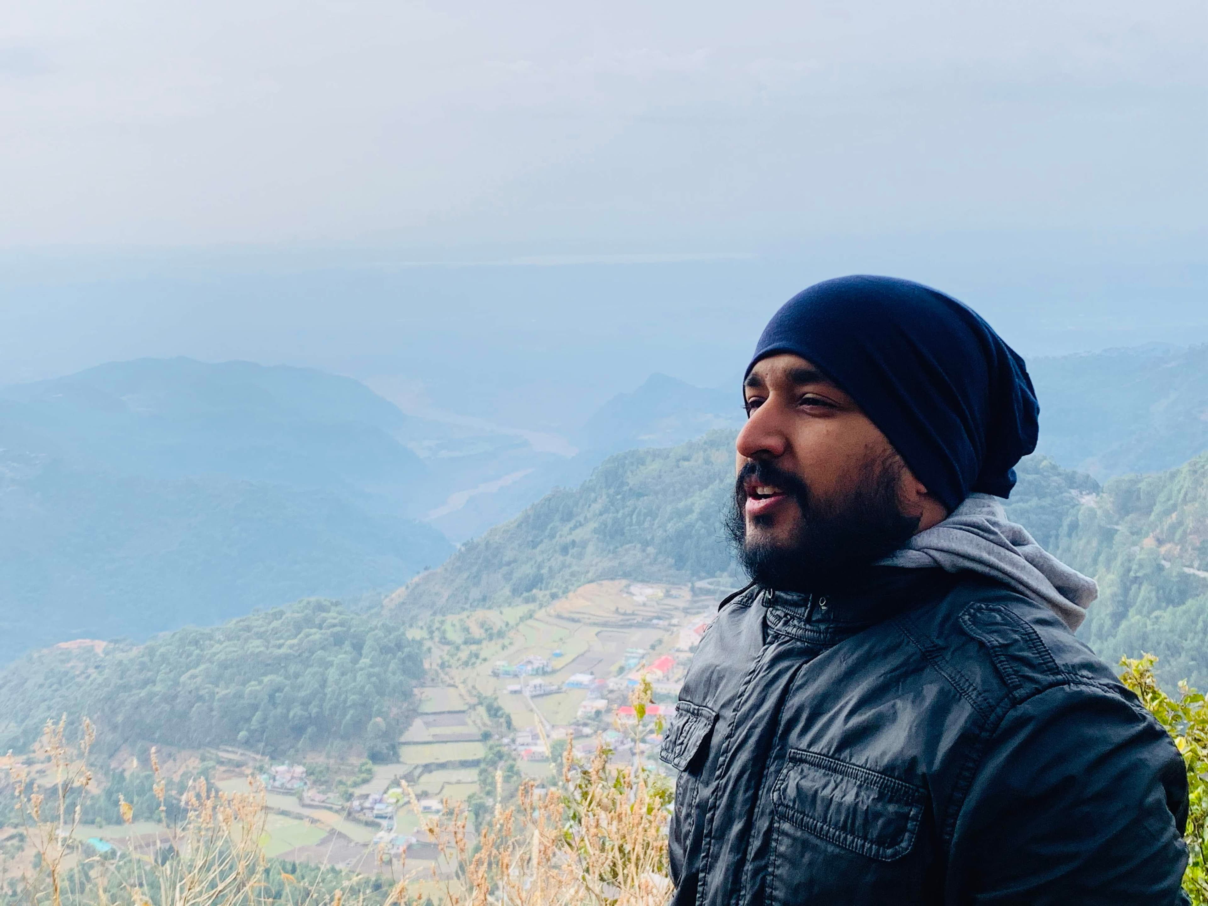 Bhavit standing against a mountain valley during our New Year 2020 trip