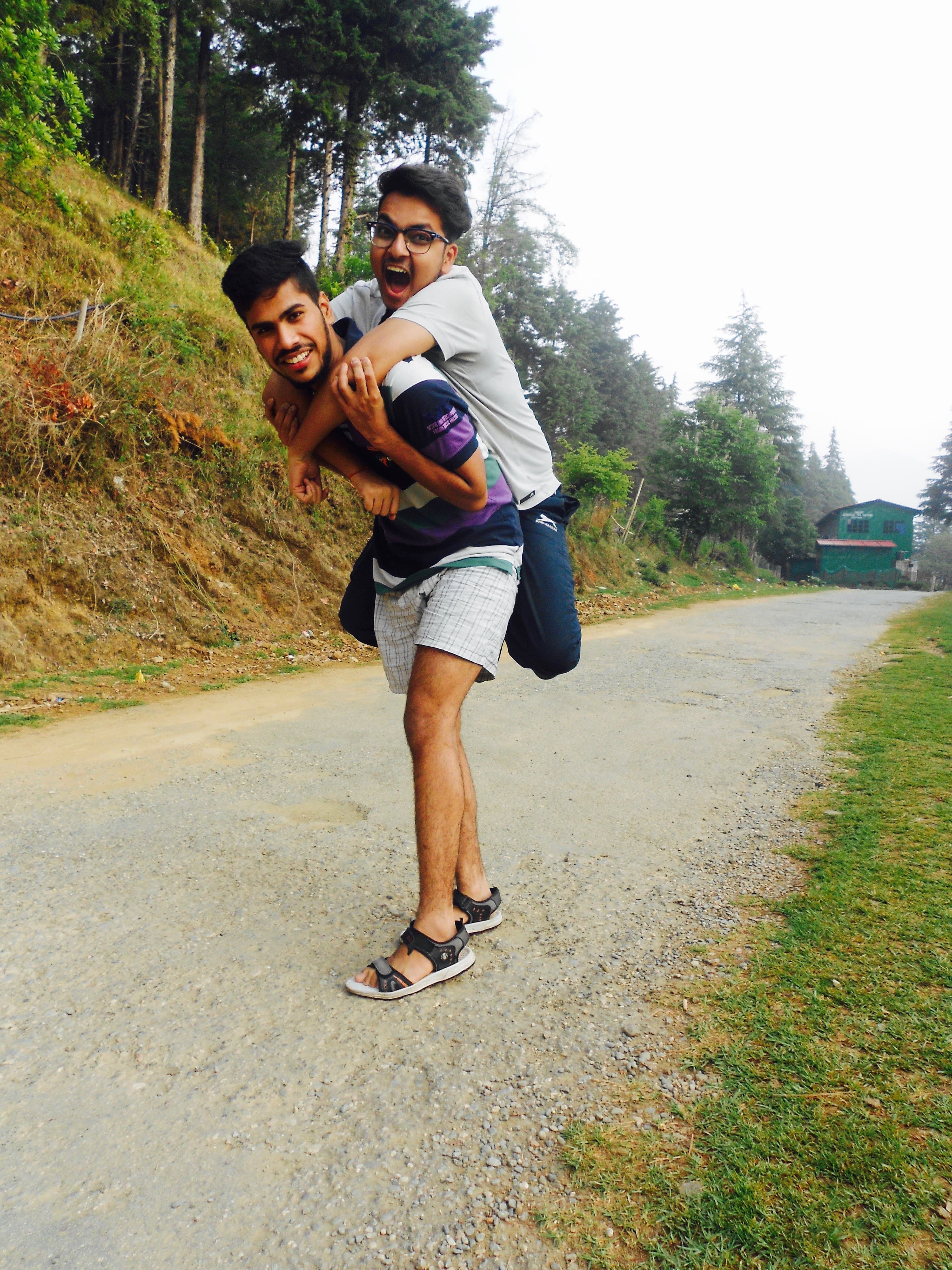 Friends walking together on a mountain road near Nainital in 2016