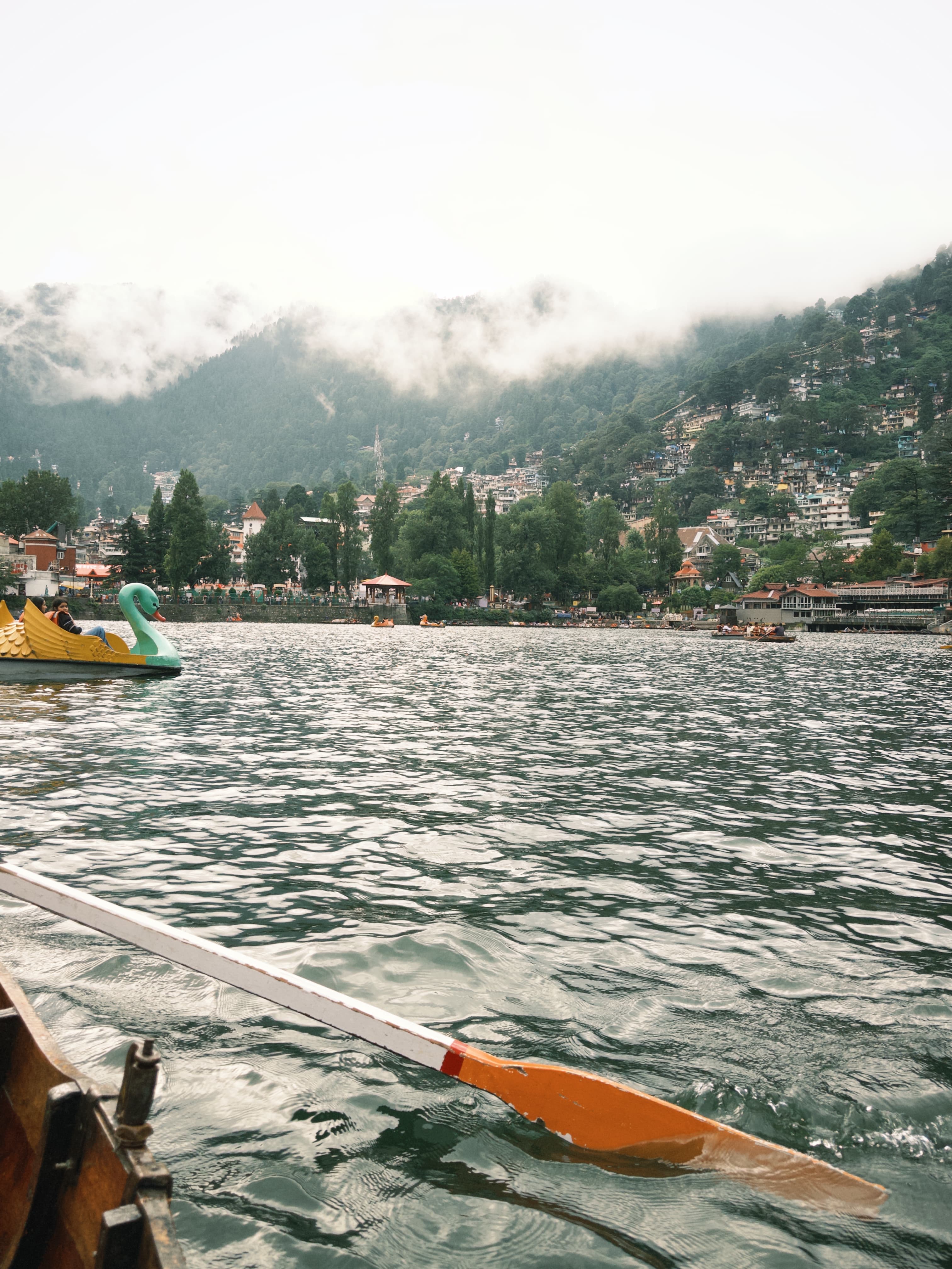 Nainital's hillside buildings seen from a boat on Naini Lake