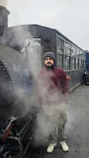 Standing near steam from Darjeeling's famous train