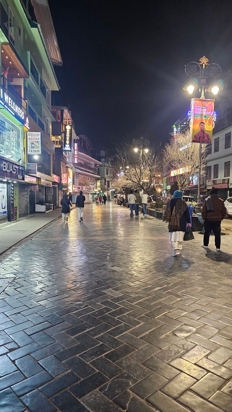 Gangtok market street at night with clean paving and shop lights