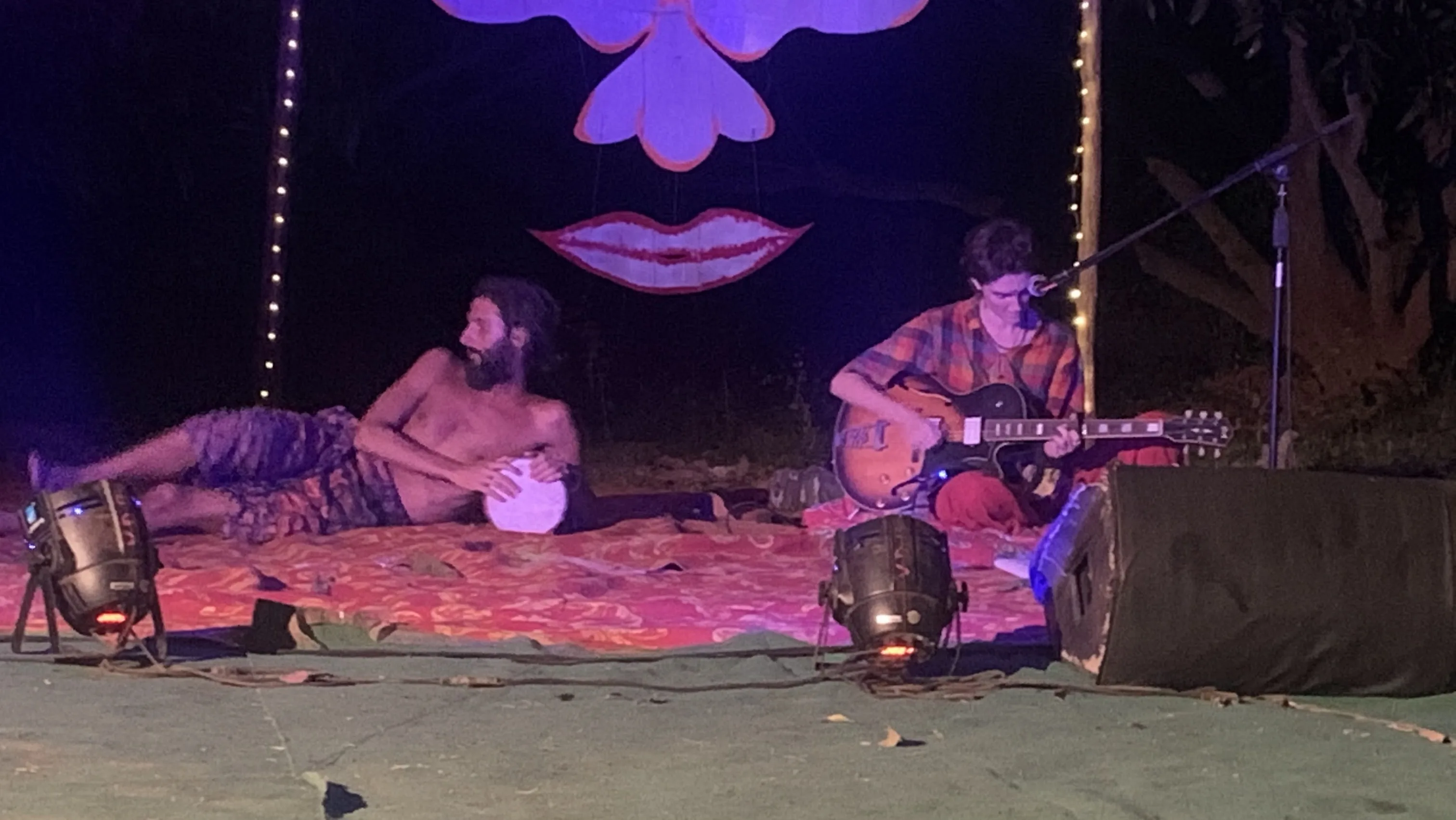 An intimate night gathering with music and conversation in Auroville