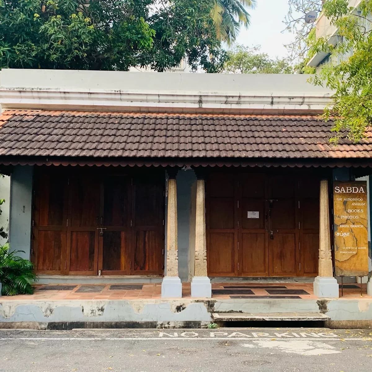 The shaded tiled facade of the Sabda bookshop in White Town